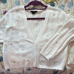 White pointe knit cardigan with adorable embroidered flowers